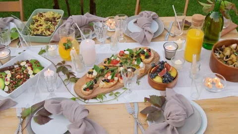 4K Beautiful Outdoor Table Laden with Mediterranean Food Spread Stock Footage 332157664
