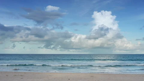 4K Beautiful tropical beach with blue sky and clouds. Tropical beach with wav Stock Footage 156226461