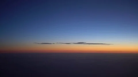 4K Beautiful View Of Aerial Clouds Through An Airplane Window In Dawn Sun-Dan Stock Footage 81421744