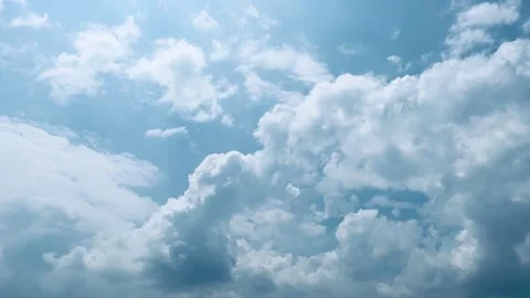 4K Beautiful white clouds moving across the blue sky time lapse Stock Footage 342143818
