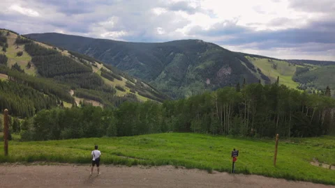4K Beaver Creek Mountains Forward Drone Shot over path with observer Stock-Footage 164680385