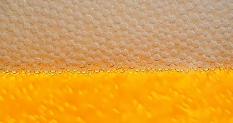 4K - Beer foam. Foam bubbles close-up Video stock 119975703