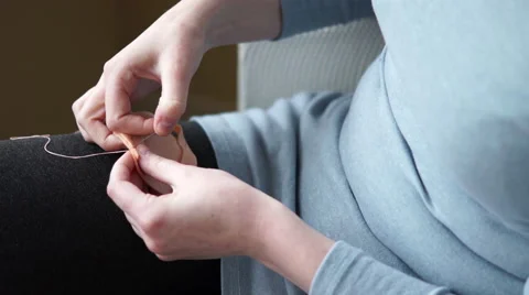 4k beginning of sewing peach felt together Stock Footage 61270618