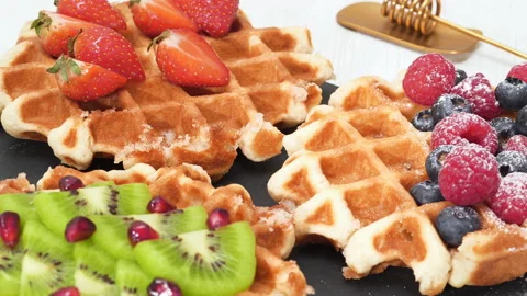 4K - Belgian waffles decorated with berries and fruits Stock Footage 166042015
