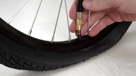 4K - Bicycle wheel inflation Stock Footage 251046641