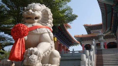 4K Big Lion Statue in front of Chinese Temple Stock Footage 124667063