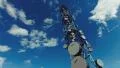 4K big tall communication tower with blue sky and clouds background 4k or 4k+ Resolution
