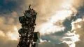 4K big tall communication tower with blue sunset sky clouds background timelapse 4k or 4k+ Resolution