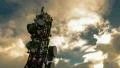 4K big tall communication tower with blue sunset sky clouds background timelapse HD Footage