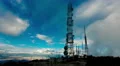 4K big tall communication towers with blue sky and clouds background 4k or 4k+ Resolution