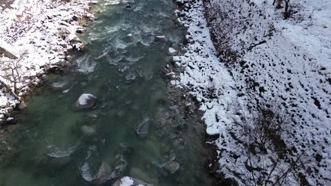 4K Bird Eye View Fly-Over River with Snow during Winter by Drone 스톡 동영상 257787510