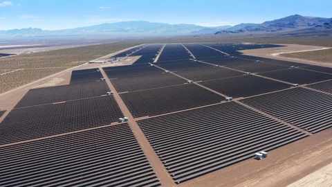 4K. Bird-eye view over the field with solar power cells. Desert landscape is Stockbeeldmateriaal 116882675