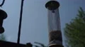 4K Birdfeed holder waves gently in the wind against blue sky and trees 4k or 4k+ Resolution