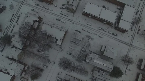 4K BIRD'S EYE VIEW DRONE SHOT, CITY COVERED IN SNOW, 24FPS Stock Footage 103518033