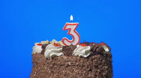 4k - Blowing out number three birthday candle on a delicious chocolate cake, blu Stock Footage 48544360