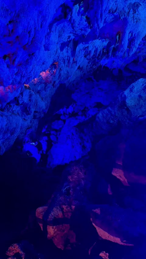 4K Blue and Emerald Green Limestone Rocks Inside Cave Okinawa, Japan Stock Footage 345377696