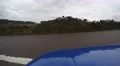 4K blue car is pulling out on a lonely road in the countryside 4k or 4k+ Resolution