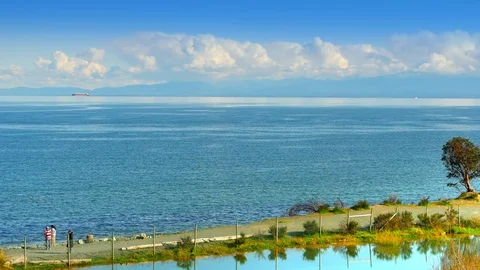 4K Blue Coast View, Mountains on Horizon Shore Blue Sky and Clouds Stock Footage 83480976