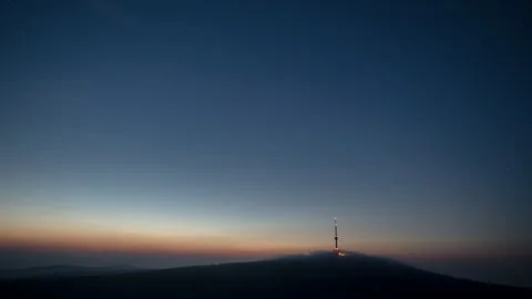 4K Blue hour and clouds rolling over the top of hill Video stock 255603386