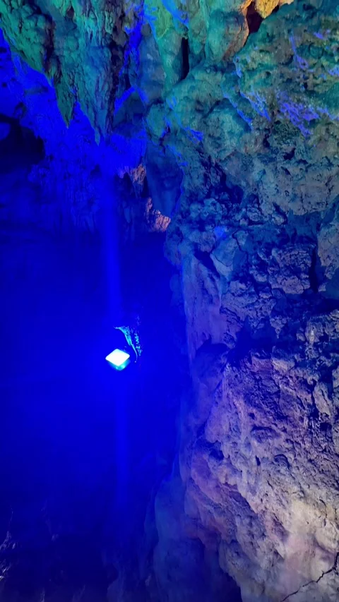 4K Blue-Lit Limestone Cave Wall and Rock Formations at Cave Okinawa, Japan Stock Footage 345376270