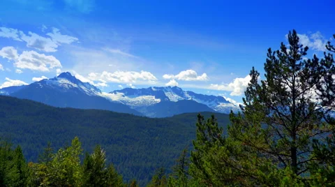 4K Blue Mountain Range, Snow Peaks and Blue Sky Wide Panorama Stock Footage 66759049