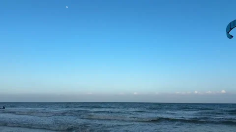 4K Blue Sky with Moon over Ocean and Soothing Wave Sounds Vídeos de archivo 332041703
