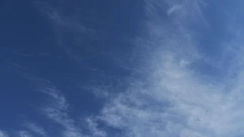 4K : Blue sky timelapse video reveals the ever-changing canvas of the sky. Wispy Stock Footage 277295068