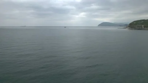 4K. Blue water with small waves turned black in cloudy weather. Stock Footage 194038745