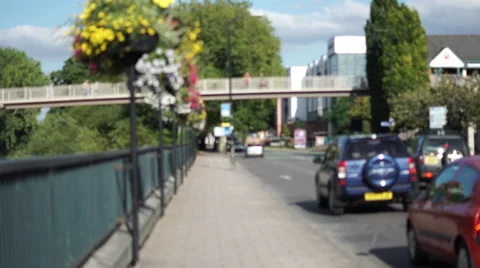 4K blurred trafic going through a british town on a sunny day Stock Footage 55434554