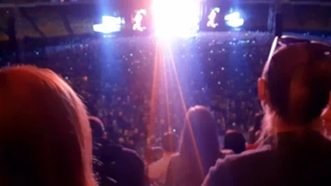 4k blurred video of big crowd listening music and dancing on rock concert at Stock Footage 107547818
