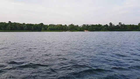 4K. The boat sails quickly along the wide river Dnepr in Kiev Stock Footage 112542320