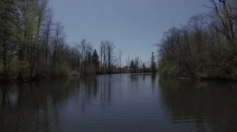 4k boating down country river Stock Footage 63067048