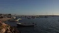 4k Boats and sailing ships lying at anchor at Avor sunset beach - Portugal 4k or 4k+ Resolution