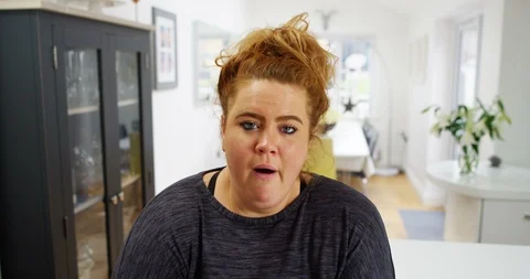 4K Bored overweight woman yawning &amp; nodding during very boring video call Stock Footage 88531663