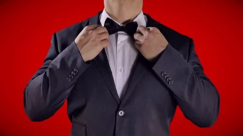 4K Bow Tie Close Up, Black and White Tuxedo Man, Bright Red Background Stock Footage 71745552