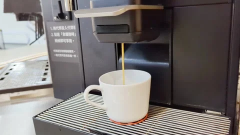 4K Brewing the Italian coffee from the machine at Ikea store Stock Footage 293469051