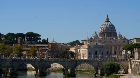 4K BRIDGE OVER THE TIBER RIVER IN ROME WITH ST. PETERS BASILICA IN BACKGROUND Stock Footage 97520473