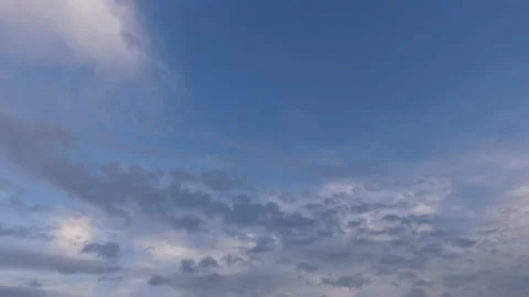 4k bright clouds, blue sky at sunrise - time lapse cloudscape - sky background Stock Footage 144469448