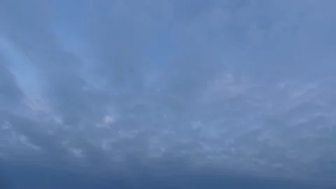 4k bright clouds, blue sky at sunrise - time lapse cloudscape - sky background Stock Footage 144470097