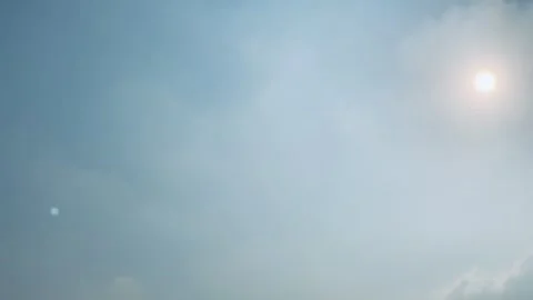 4K Bright Sun in Blue Sky With Thin Clouds Slow Pan Jakarta Stock Footage 341548494