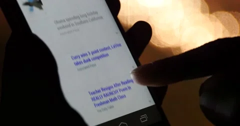 4k Browsing news On Smartphone Iphone,Search information on website at night. 库存影片 47533841