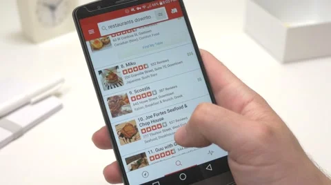 4K Browsing Restaurants on Yelp Review App Stock Footage