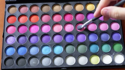 4K Brush taking some eyeshadow from a palette of multicolor makeup Stock Footage 50685779