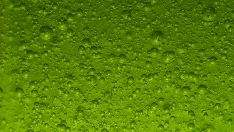 4K Bubbles on green background slow motion Stock Footage 128246410