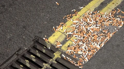 4K Burned cigarette end junky road trash pollution smoking area toxic butt stub  Stock Footage 52233368