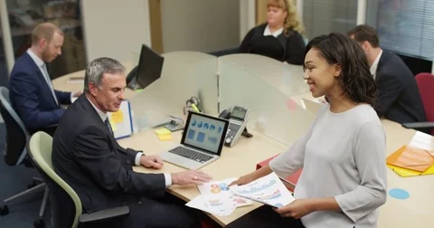 4K Business man & woman discussing paperwork in the office Stock Footage