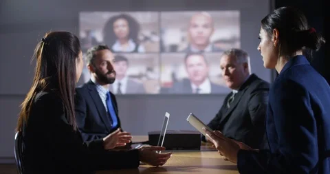 4K Business team connected to multiple colleagues on split screen video call 動画素材 104648178