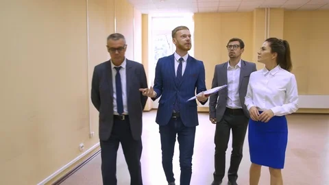 4K Business team viewing empty commercial property &amp; shaking hands with agents Stock Footage 124693537