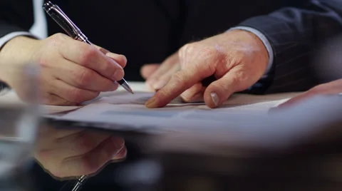4K Businessman signs a contract and shakes hands on the deal. Stock Footage