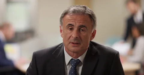 4K Businessman unable to hide his boredom during very boring conference call Stock Footage 76350188
